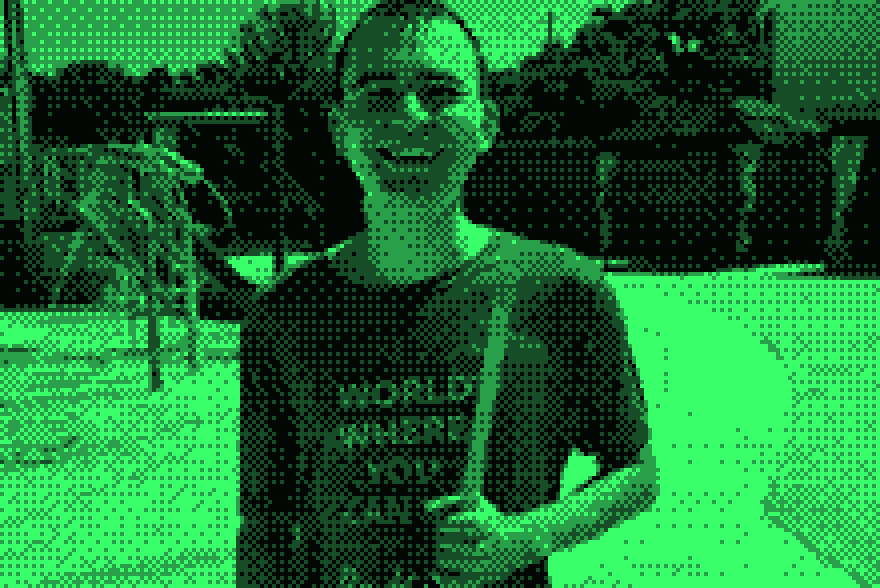 Our son grinning at the splash pad